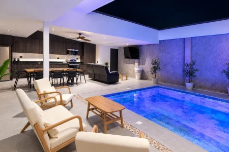 Poolside seating at night at Palma Roots Villa, Jaco Beach, Costa Rica